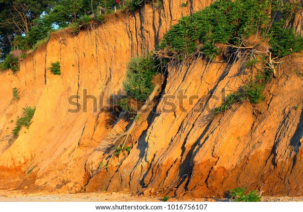 Landslide, rockfall on steep slopes of limestone\
mountains of northern Black Sea coast. Zone of natural disasters\
during rainy season. Large masses of earth slip along slope of\
hill, destroy\
houses.