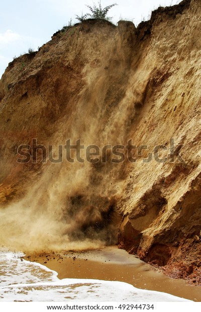Landslide, rockfall on steep slopes of
limestone mountains of northern Black Sea coast. Dramatic moment
slipping hillside. Avalanche danger for tourists on wild beach.
Landslide - life
threatening