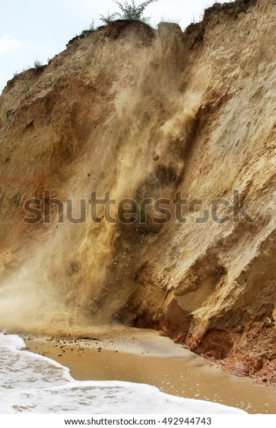 Landslide, rockfall on steep slopes of\
limestone mountains of northern Black Sea coast. Dramatic moment\
slipping hillside. Avalanche danger for tourists on wild beach.\
Landslide - life\
threatening