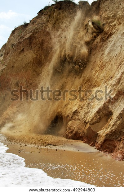 Landslide, rockfall on steep slopes of\
limestone mountains of northern Black Sea coast. Dramatic moment\
slipping hillside. Avalanche danger for tourists on wild beach.\
Landslide - life\
threatening