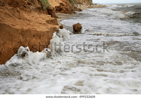 The\
landslide, rockfall on the steep slopes of the limestone mountains\
of the northern Black Sea coast. Dramatic moment slipping hillside.\
avalanche danger for tourists on wild beach.\
