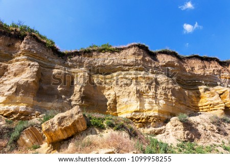 Landslide slope of mountain. Danger of rockfall, descent of stone avalanches. Mountain landscape of dangerous stony surfaces
