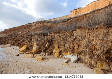 Landslide zone on Black Sea coast. Rock of sea rock shell. Zone of natural disasters during rainy season. Large masses of earth slip along slope of hill, destroy houses. Landslide - threat to life
