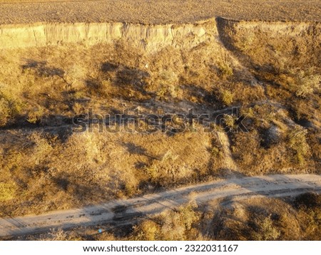Landslide zone on Black Sea coast. Rock of sea rock shell. Zone of natural disasters during rainy season. Large masses of earth slip along slope of hill, destroy houses. High quality photo
