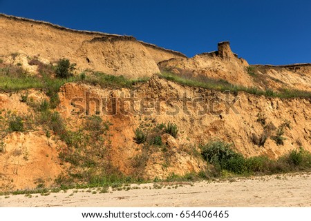 Landslide zone on Black Sea coast. Zone of natural disasters during rainy season. Large masses of earth slip along slope of hill, destroy houses. Landslide - threat to life