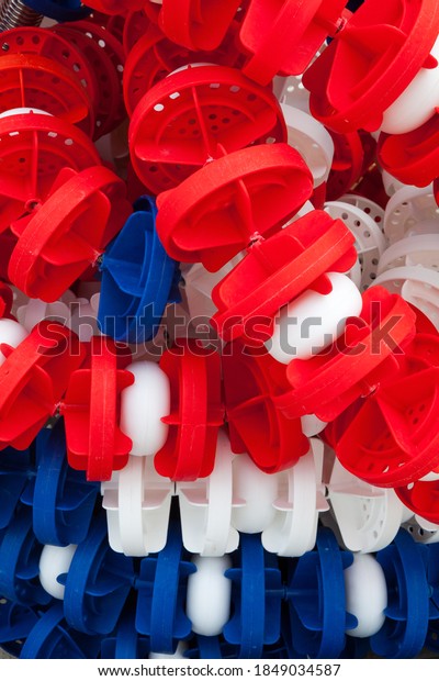 Lane divider, pool marker lines. Piled and\
stacked. Line dividers pool piled, full image. Blue, red and white.\
Full background. Plastic\
material.