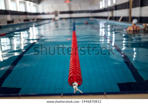 lane divider in the pool. swimming pool with\
clean water for athletes\
training