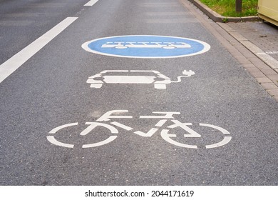 Lane marking for electric cars, buses and bicycles.                                - Shutterstock ID 2044171619