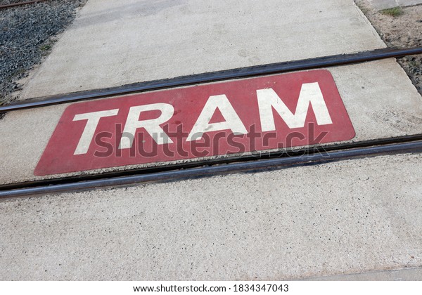 Lane marking for tram tracks crossing the road,\
public transport
