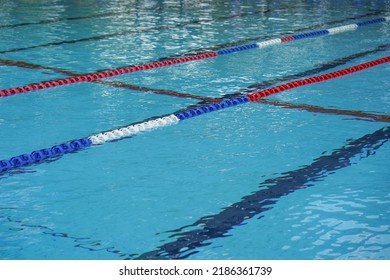 Lanes Of A Competition Swimming Pool. Empty Swimming Pool With Lanes