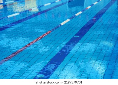 Lanes Of A Competition Swimming Pool. Empty Swimming Pool With Lanes