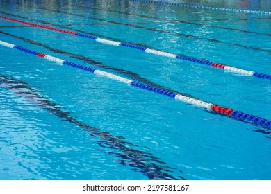 Lanes Of A Competition Swimming Pool. Empty Swimming Pool With Lanes