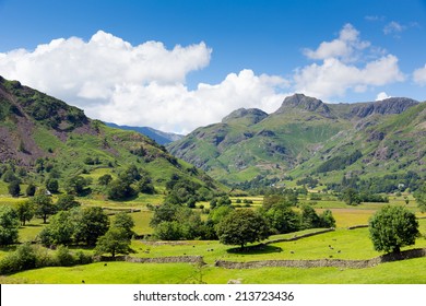 Langdale Valley Lake District Cumbria With Mountains Blue Sky And Clouds On Beautiful Summer Day 