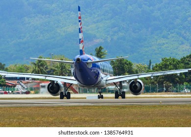 Langkawi, Malaysia - Mar 30, 2019. An Airbus A320 Airplane Of AirAsia (9M-AFV Queens Park Rangers) Taxiing On Runway Of Langkawi Airport (LGK).