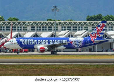 Langkawi, Malaysia - Mar 30, 2019. An Airbus A320 Airplane Of AirAsia (9M-AFV Queens Park Rangers) Taxiing On Runway Of Langkawi Airport (LGK).