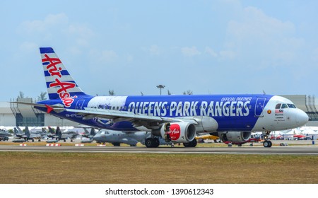 Langkawi, Malaysia - Mar 30, 2019. An Airbus A320 Airplane Of AirAsia (9M-AFV Queens Park Rangers) Taxiing On Runway Of Langkawi Airport (LGK).