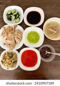 LANGKAWI, MALAYSIA - Stemed chicken with sesame oil, bean sprouts fish cakes with oyster sauce, black sweet soy sauce, green paste, chilli paste, black chilli and soy sauce, aromatic soup.