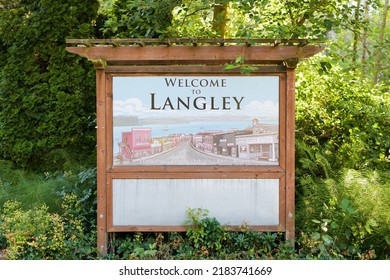 Langley, WA, USA - July 26, 2022; Wooden Welcome To Langley Sign On Whidbey Island Washington