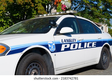 Langley, WA, USA - July 26, 2022; City Of Langley Blue And White Police Car Parked In Summer