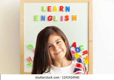 Language Education Concept. Learn English. Do You Speak English. Cute Little Child Girl With Colored Letters On The Blackboard. English Language School. English For Children.