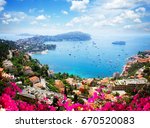 lanscape of riviera coast, turquiose water, flowers and blue sky of cote dAzur at summer day, France, retro toned