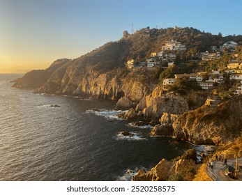 A lanscape with a rocky ocean cliffside during sunset golden hour - Powered by Shutterstock