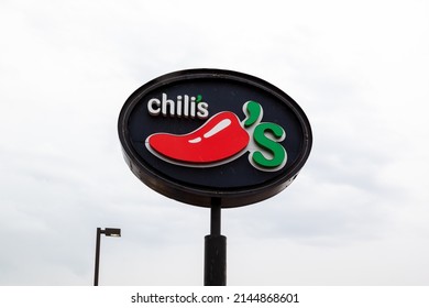 Lansing, Michigan, USA - March 30, 2022: Closeup Of Chili's Pole Sign With Sky In Background. Chili's Grill And Bar Is An American Casual Dining Restaurant Chain. Editorial Use Only. 