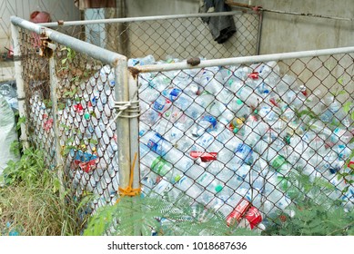 LANTA, KRABI, THAILAND, AUG 18, 2017: People Divide The Garbage Such As Plastic Bottle In The Storage Cage For The Recycle Process