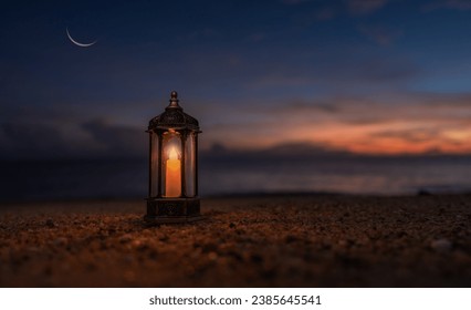 Lantern candle on sand beach twilight sunset sky and crescent moon, Religion of Islamic well free space for text Ramadan Kareem, Eid Al Adha, Eid Al Fitr, Mubarak  - Powered by Shutterstock