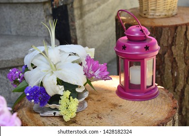 Lantern And Flowers On A Trunk As Part Of The Decoration Of A Restaurant To Celebrate A Feast Of First Communion