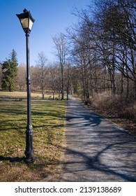 lantern in the park on the side of the road