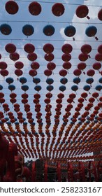 The lanterns are arranged in a pattern with red, yellow, blue, and a few green lanterns. Each lantern has some text written on it, likely in Chinese characters.