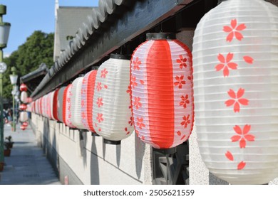 a lot of lanterns hanging