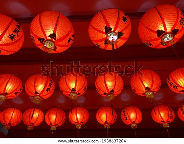 Lanterns hanging at a\
traditional temple (the characters on the lanterns are the prayers\
for blessings)