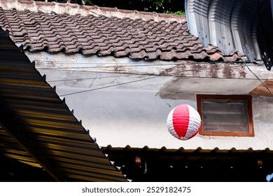 Lanterns in an urban alley. Red and white lanterns. Handmade lanterns in pedestrian alleys.  - Powered by Shutterstock