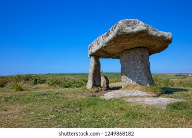 Lanyon Quoit, with a distant mining enginehouse behind, Cornwall, England, UK.