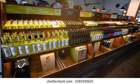 Lanzarote, Canary Islands, Spain, July 1, 2022: Large Selection Of Traditional Bottled Volcanic Wine On The Shelves Of The Popular Winery Bodega La Geria In Lanzarote, Spain