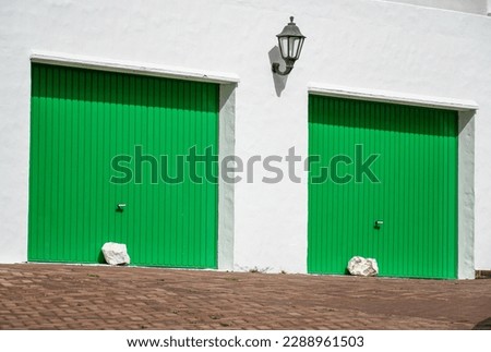 Lanzarote, white color architecture and green parking doors, a different and wonderful island, Canary Islands, Spain, Europe