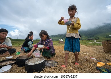 Lao Cai, Vietnam - Sep 7, 2017: Ethnic Minority Farmer Family Having Lunch On Rice Field In Sapa