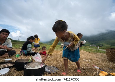 Lao Cai, Vietnam - Sep 7, 2017: Ethnic Minority Farmer Family Having Lunch On Rice Field In Sapa