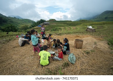 Lao Cai, Vietnam - Sep 7, 2017: Ethnic Minority Farmer Family Having Lunch On Rice Field In Sapa