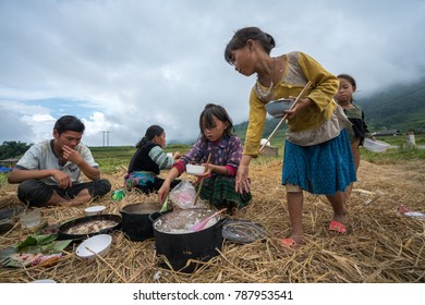 Lao Cai, Vietnam - Sep 7, 2017: Ethnic Minority Farmer Family Having Lunch On Rice Field In Sapa