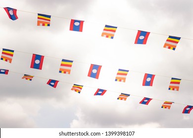 Lao flag and religious flag - Shutterstock ID 1399398107