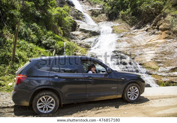 Laocai, Vietnam - May\
28, 2016: BMW X3 xDrive28i car on the test road in test drive,\
mountain area Vietnam.