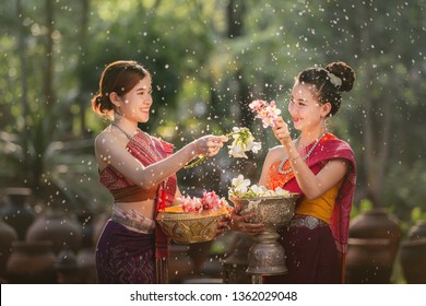 laos girls splashing water during festival Songkran festival