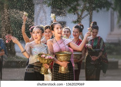 laos girls splashing water during festival Songkran festival
