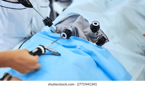 Laparoscopic surgery in progress, surgeon operating on a patient in operating room