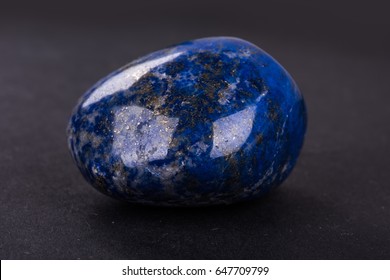 Lapis Lazuli Geode On Black Background. Beautiful Natural Crystal Gemstone.