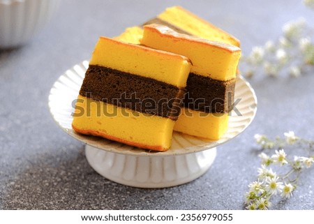 Lapis surabaya or three layer cake in white plate