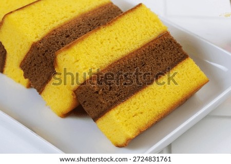 Lapis surabaya or three layer cake in white plate
